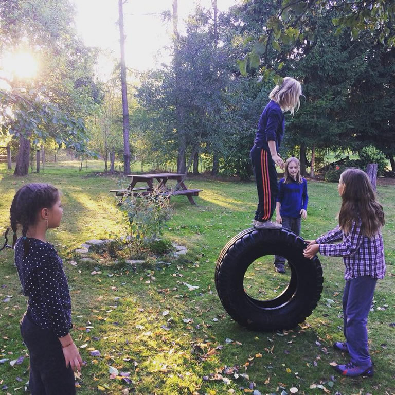 children playing with a tyre